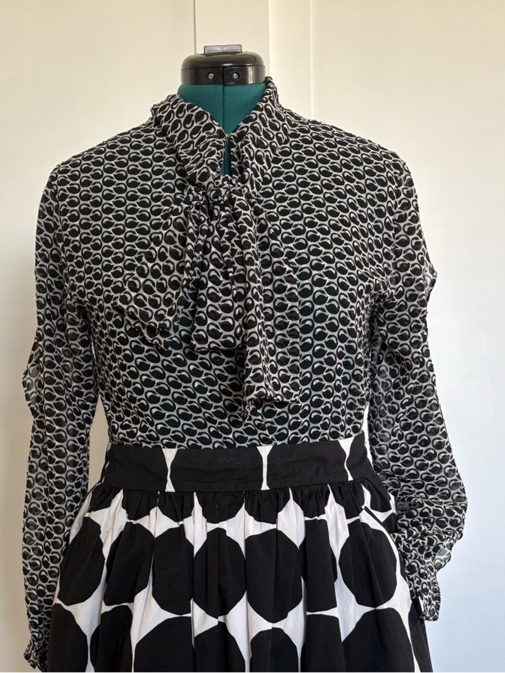 Ann Taylor Black and White black swan blouse.